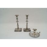 A pair of Edwardian silver candlesticks, Birmingham, 1900 and 1902, I S Greenberg & Co, damaged,