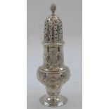 An early George III silver sugar caster, London, 1761 maker's mark rubbed, repousse decorated with