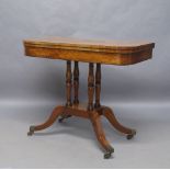 A Regency mahogany card table, ebony strung, the rectangular top with rounded edges, raised on