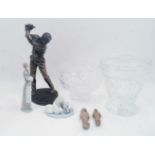 A bronzed resin figure of a golfer, missing club, on naturalistic base, 42.5cm high, together with a