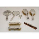 A six piece silver mounted vanity set, comprising: a hand mirror, four brushes, and a comb, Chester,