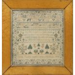 A Victorian needlework pictorial sampler, worked by Emily Foxley, aged 8, dated March 24 1853,