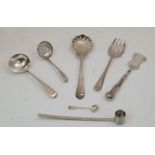 A small group of silver sifting and serving implements, comprising: a George III silver sugar