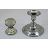 A French dwarf pewter candlestick, with urn sconce on spreading stepped circular base, stamped to