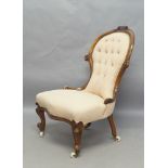 A Victorian mahogany nursing chair, with button back upholstery, raised on cabriole legs and