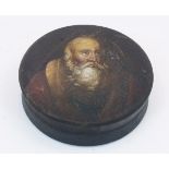 A Stobwasser type papier-mache snuff box, 19th century, of circular form, the pull-off top painted
