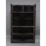 An oak bookcase, 18th century and later, with two curved glass doors above four open shelves,