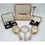 A group of silver, comprising: a cased set of six silver handled dessert knives and forks,