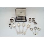 A group of silver oddments and flatware, to include: two fiddle pattern table spoons by Charles