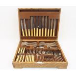 An oak canteen of Elkington Plate cutlery, comprising: six table forks, six table spoons; six