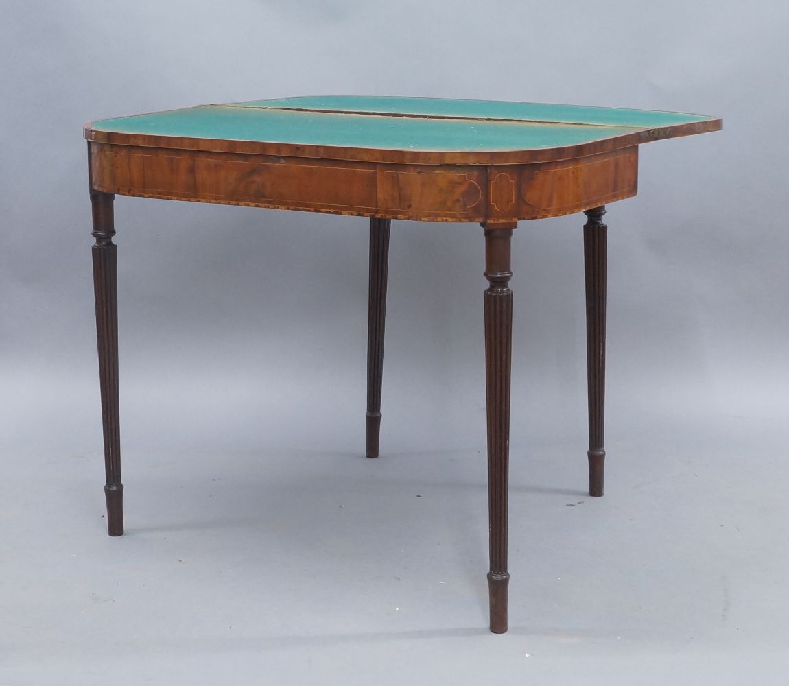 A George III mahogany card table, boxwood inlaid, raised on reeded tapered legs, 73cm high, 92cm - Image 2 of 2