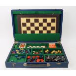 A games compendium, early 20th century, containing chess board and pieces, chequers, the