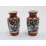 A pair of Japanese miniature Kutani vases, late 19th century, each of baluster form, painted to