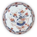 A Chinese Imari saucer-dish, 18th century, painted to the well with a rabbit and a flowering