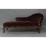 A Victorian rosewood chaise lounge, with recent purple corduroy upholstery, the spoon back rest