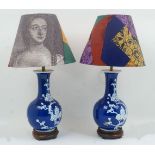 A pair of modern Chinese blue and white baluster vase lamps, decorated with prunus blossom motifs,