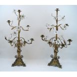 A pair of Continental brass candelabra, 19th century, the sconces modelled as flowering plants