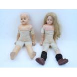 Two large composition head dolls, both on cloth bodies with composition lower limbs (2)Please