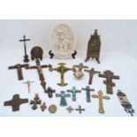 A quantity of crucifixes, early 20th century and later, to include brass, wood, silver plate and