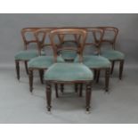 A set of seven Victorian mahogany chairs, to include an armchair and six matching dining chairs (7)