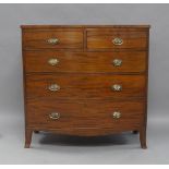 A Regency mahogany bow front chest of drawers, two short over three long, raised on splayed legs,