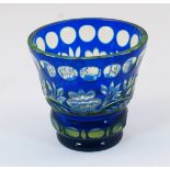 A Bohemian green and blue cut glass vase, 20th century, of squat goblet form with panelling and