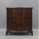 A George III style mahogany serpentine front bachelors chest, early 20th century, with brush slide