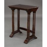 A Regency mahogany nest of three tables, brass inlaid, with ring turned supports, joined by