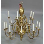 A Dutch style brass fifteen branch chandelier, 20th century, the baluster stem issuing two tiers