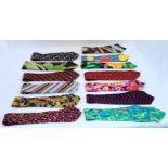 A collection of gentleman's ties, mostly silk examples, to include: Gianni Versace, Valentino,