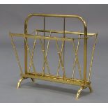 A French brass folding magazine rack, circa 1960, with folding sides on curved supports, 43cm