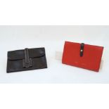 Hermes: a Jige black leather clutch, bearing date stamp A within a square for 1997, with cream