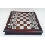 A Danbury Mint BBC licenced Doctor Who chess set, with 38 pewter chess pieces in original wooden box