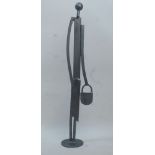 Glyn Walton, British, late 20th/early 21st century- Standing figure holding a handbag; steel, 62cm