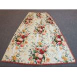 A set of curtains, 20th century, each with floral print on a cream ground with red tassels,