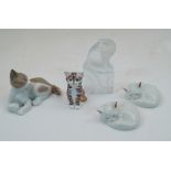 A group of ceramic and glass cats, to include a modern Lalique frosted glass cat sat atop a