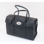 Mulberry: a Bayswater black grain leather satchel handbag, with flap closure and metal escutcheon