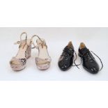 Prada: a pair of black patent leather lace up shoes, size '38.5', with gilded logo to insole and