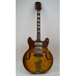 A Harmony model H-75 hollow body electric guitar, circa 1960's, two-tone yellow burst finish,