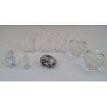 A group of clear glass paperweights, 20th century, to include two modelled as apples, each 10cm