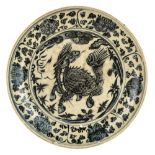 An Annamese blue and white 'Qilin' dish, 17th century, painted to the centre with a qilin with its