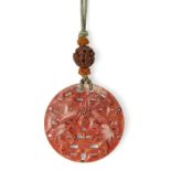 Property of a Gentleman (Lots 55-80) A Chinese coral 'dragon' pendant, 18th/19th century, finely