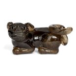 A Chinese rock crystal carving of a lion dog, 19th century, carved in recumbent pose with head and