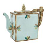 A Japanese celadon-glazed teapot, 20th century, of rectangular form with simulated bamboo handle and