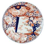 A massive Japanese Imari charger, Meiji period, gilt and painted in iron red and underglaze blue