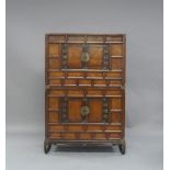 A Korean elm wood chest set, 19th century, composed of two parts, each built with rounded framing