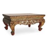 A Thai giltwood 'jewelled' offering table, 19th century, with carved and pierced lotus bloom apron