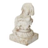 A Chinese marble figure of a bodhisattva, Tang Dynasty, seated in lalitasana over a double-lotus