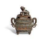 A Japanese bronze 'temple lion' incense burner, koro, Meiji period, of square form atop four feet,