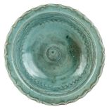 A large Thai Sawankhalok celadon-glazed bowl, 16th century, carved with foliate rim incised with a